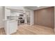 Bright open kitchen with white cabinets, stainless steel appliances and light wood floors at 16402 N 31St St # 232, Phoenix, AZ 85032