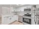 Well-equipped kitchen with stainless steel appliances, modern cabinets, and light wood floors at 16402 N 31St St # 232, Phoenix, AZ 85032