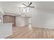 Bright and airy living room with high ceilings and light wood floors leading to an open concept kitchen area at 16402 N 31St St # 232, Phoenix, AZ 85032