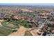 Wide aerial perspective of a community showcasing the golf course, pickleball courts, and the neighborhood layout at 16945 W Vernon Ave, Goodyear, AZ 85395