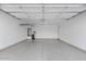 Spacious and organized garage featuring ample storage space and a clean, well-maintained floor at 16945 W Vernon Ave, Goodyear, AZ 85395