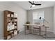 Inviting home office with a sleek desk, custom shelving, natural light, providing a productive and stylish workspace at 16945 W Vernon Ave, Goodyear, AZ 85395