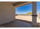 View of the backyard patio, featuring a blank canvas of desert landscape at 16996 W Fetlock Trl, Surprise, AZ 85387