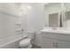 Bright bathroom featuring a tub and shower, sink, and toilet at 16996 W Fetlock Trl, Surprise, AZ 85387