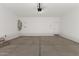 A spacious garage provides ample parking and storage space for vehicles and belongings at 16996 W Fetlock Trl, Surprise, AZ 85387