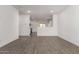 Open-concept living room with tile flooring, bright walls, and recessed lighting at 16996 W Fetlock Trl, Surprise, AZ 85387