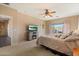 Relaxing bedroom with soft textures, a TV, and a soothing color scheme for unwinding at the end of the day at 18585 E Ryan Rd, Queen Creek, AZ 85142