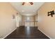 A bright and airy hallway, well-lit with natural light, connects the living spaces in the home at 18585 E Ryan Rd, Queen Creek, AZ 85142
