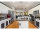 The well-appointed kitchen features stainless steel appliances and ample storage, seamlessly flowing into the living area at 18585 E Ryan Rd, Queen Creek, AZ 85142