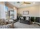 Comfortable sitting area with large windows showcasing the pool, neutral paint, and wood-look floors at 18585 E Ryan Rd, Queen Creek, AZ 85142