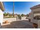 Private outdoor space with views of neighborhood homes with mature landscaping, enclosed by decorative walls at 19740 N Wind Rose Way, Surprise, AZ 85374