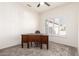 Bedroom featuring neutral walls, plush carpet, and a wooden desk near a window at 19740 N Wind Rose Way, Surprise, AZ 85374