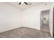 Bright bedroom featuring neutral walls, plush carpet, and a ceiling fan at 19740 N Wind Rose Way, Surprise, AZ 85374
