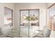 Sunlit dining area with a glass table, cushioned chairs, and views of the landscaped yard at 19740 N Wind Rose Way, Surprise, AZ 85374