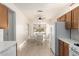 Kitchen view to dining area; features updated appliances and tile floors at 19740 N Wind Rose Way, Surprise, AZ 85374