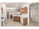 Kitchen view features a stainless sink, light countertops and wood cabinets at 19740 N Wind Rose Way, Surprise, AZ 85374