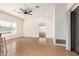 A bright living room with light wood floors and light walls, accentuated by natural light at 19740 N Wind Rose Way, Surprise, AZ 85374