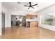 This living room features wood floors, bright light, and a built-in wet bar at 19740 N Wind Rose Way, Surprise, AZ 85374