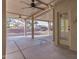 Covered patio with ceiling fans and a view of the gravel-filled backyard at 19740 N Wind Rose Way, Surprise, AZ 85374