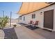 Charming back patio with two chairs, cactus, sunshade and concrete patio at 2068 E Orange St, Tempe, AZ 85281