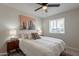 Cozy bedroom with a ceiling fan, large window, and stylish furnishings at 2068 E Orange St, Tempe, AZ 85281