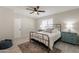 Bedroom with a metal bed frame, ceiling fan, and neutral walls at 2068 E Orange St, Tempe, AZ 85281