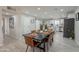 Elegant dining room with a large table, modern chairs, and an open layout to the kitchen at 2068 E Orange St, Tempe, AZ 85281