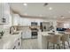 Bright kitchen with white cabinets, stainless steel appliances, and island with seating at 2068 E Orange St, Tempe, AZ 85281