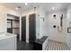 Modern bathroom featuring a frameless glass shower, built-in bench, and stylish tile floors at 2316 N Mitchell St, Phoenix, AZ 85006