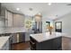Modern kitchen features stainless steel appliances, white countertops, and gray cabinets, designed for culinary excellence at 2316 N Mitchell St, Phoenix, AZ 85006