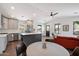 Bright, open kitchen features modern appliances, an island with white countertops and easy access to the dining area at 2316 N Mitchell St, Phoenix, AZ 85006