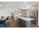 Bright kitchen with an island and hardwood floors flows into an open floorplan with dining area and other living space at 2316 N Mitchell St, Phoenix, AZ 85006