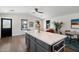 Bright living room showcases modern decor, hardwood floors, a kitchen island and a comfortable seating area at 2316 N Mitchell St, Phoenix, AZ 85006