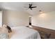 Bright main bedroom with wood floors, ceiling fan, and a glass door to an outdoor space at 2316 N Mitchell St, Phoenix, AZ 85006