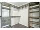 Spacious walk-in closet featuring custom shelving, drawers and ample storage at 2316 N Mitchell St, Phoenix, AZ 85006