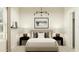 Cozy bedroom with neutral decor and a patterned accent wall and rug at 23196 W Marguerite Ave, Buckeye, AZ 85326