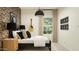 Modern bedroom with patterned wallpaper, stylish decor, and lots of light at 23196 W Marguerite Ave, Buckeye, AZ 85326