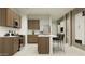 Spacious kitchen with a center island, stainless steel appliances, and light tile flooring at 23196 W Marguerite Ave, Buckeye, AZ 85326