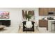 Open concept living and dining area featuring a modern design and hardwood floors at 23196 W Marguerite Ave, Buckeye, AZ 85326
