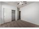 Bedroom with neutral carpet and a sliding double door closet at 23789 W Chipman Rd, Buckeye, AZ 85326