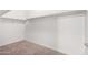 Walk-in closet featuring white walls, neutral carpet and installed shelving at 23789 W Chipman Rd, Buckeye, AZ 85326