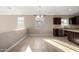 Open dining area with tile flooring, natural light, and a view of the kitchen at 23789 W Chipman Rd, Buckeye, AZ 85326