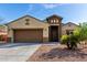 Charming single-story home with a two-car garage and well-maintained landscaping at 23789 W Chipman Rd, Buckeye, AZ 85326