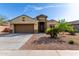 Beautiful single-Gathering home featuring a well-manicured front yard and inviting entryway at 23789 W Chipman Rd, Buckeye, AZ 85326