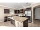 Bright kitchen features a large island, stainless appliances and lots of counter space at 23789 W Chipman Rd, Buckeye, AZ 85326