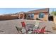 Open backyard with gravel and patio, ideal for outdoor living at 26049 W Matthew Dr, Buckeye, AZ 85396