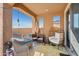 Cozy covered patio features comfortable seating and stylish decor at 26049 W Matthew Dr, Buckeye, AZ 85396