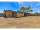 Expansive backyard with string lights, block wall, and seating area at 2808 W Lawrence Rd, Phoenix, AZ 85017