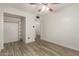 Bedroom with plank floors, closet, and natural light at 2808 W Lawrence Rd, Phoenix, AZ 85017