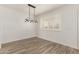 Dining area with modern lighting, tiled flooring, and bright window at 2808 W Lawrence Rd, Phoenix, AZ 85017